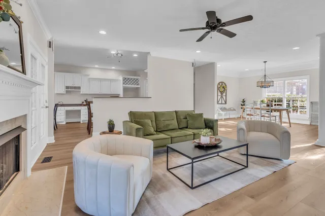 a living room with furniture and a fireplace