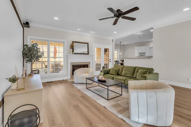 a living room with furniture and a table