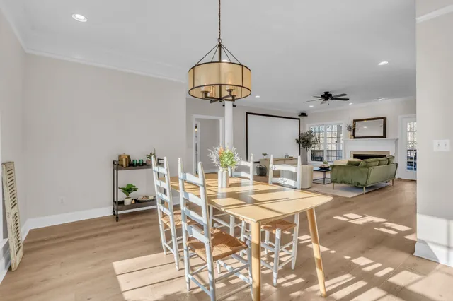 a kitchen with a sink cabinets and wooden floor