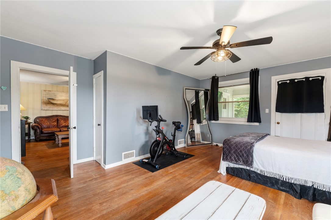 1105 Greenacres Anderson, SC 29621 - Photo 24 of 46 Hardwood floors and ample natural light define this cozy bedroom with direct access to a separate living area.