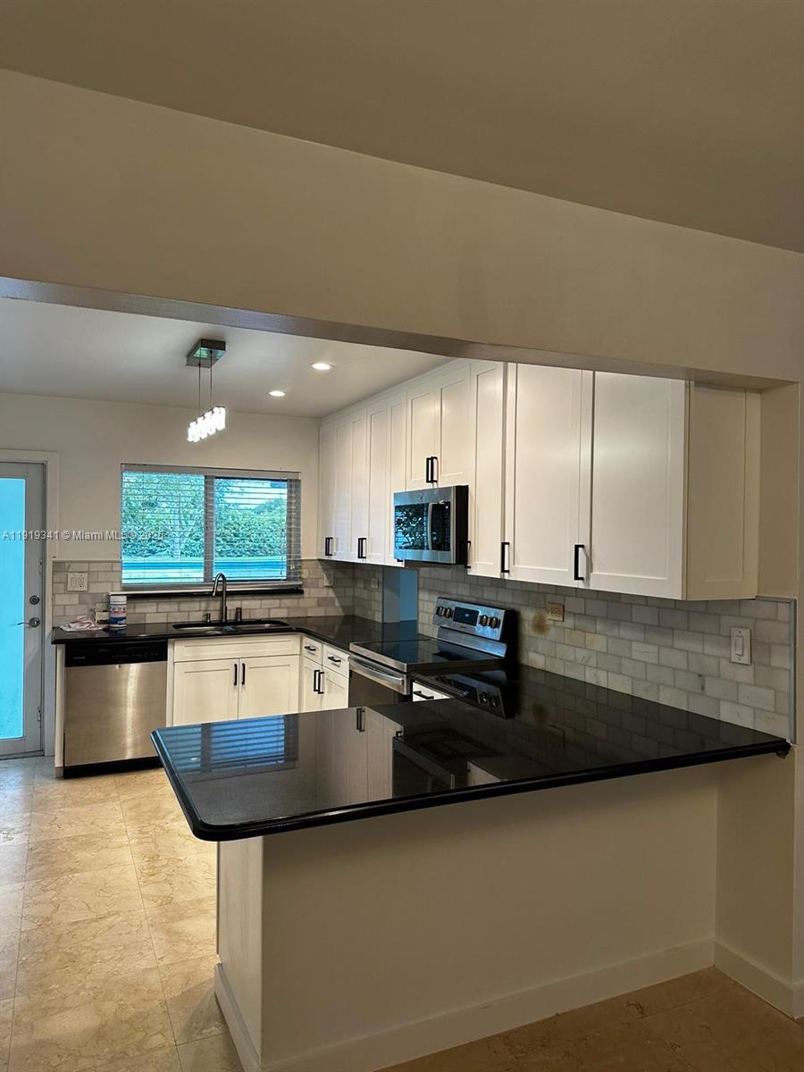 9940 Southwest 62nd Street Miami, FL 33173 - Photo 23 of 28 NEW KITCHEN