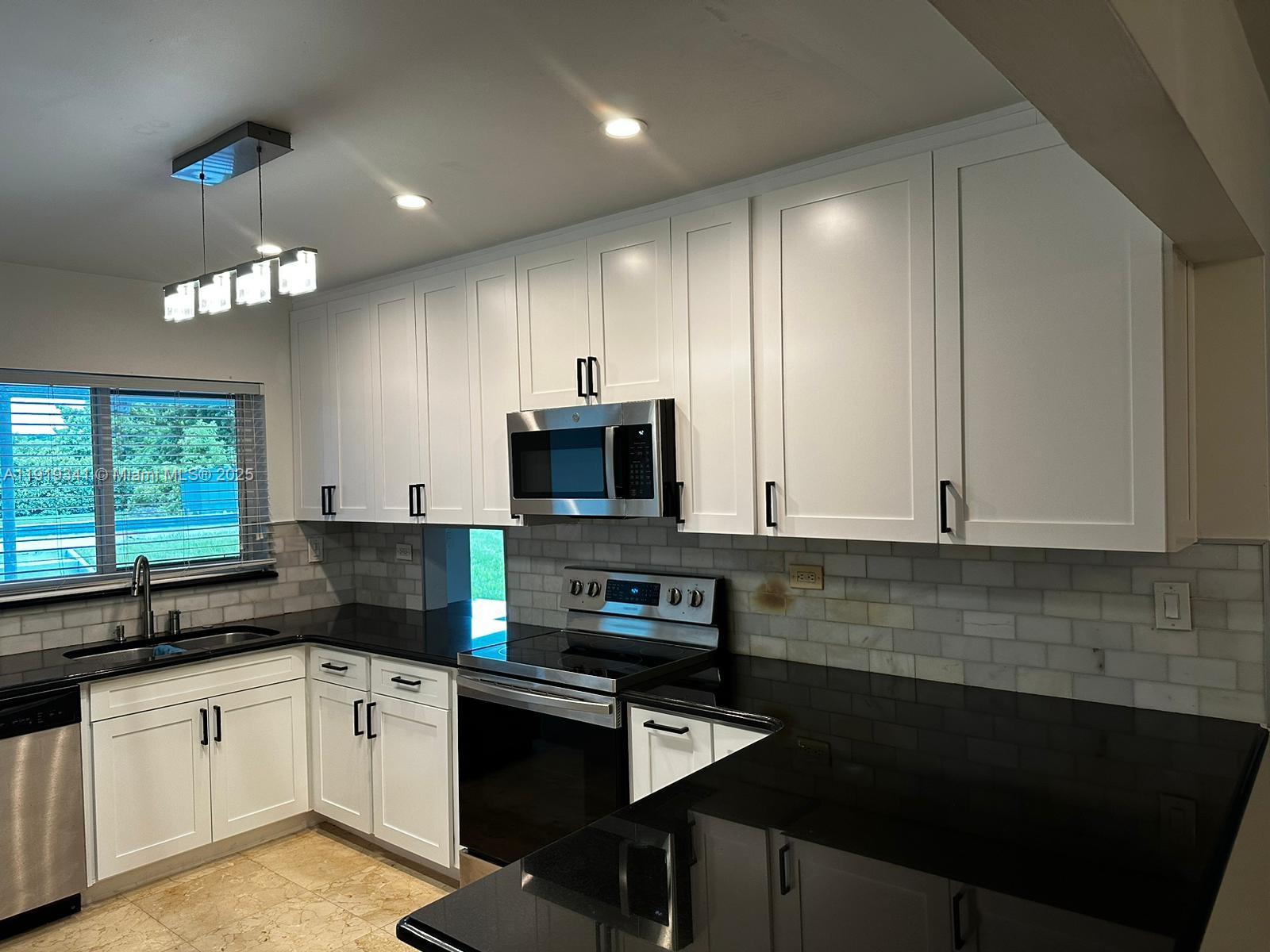 9940 Southwest 62nd Street Miami, FL 33173 - Photo 25 of 28 NEW KITCHEN