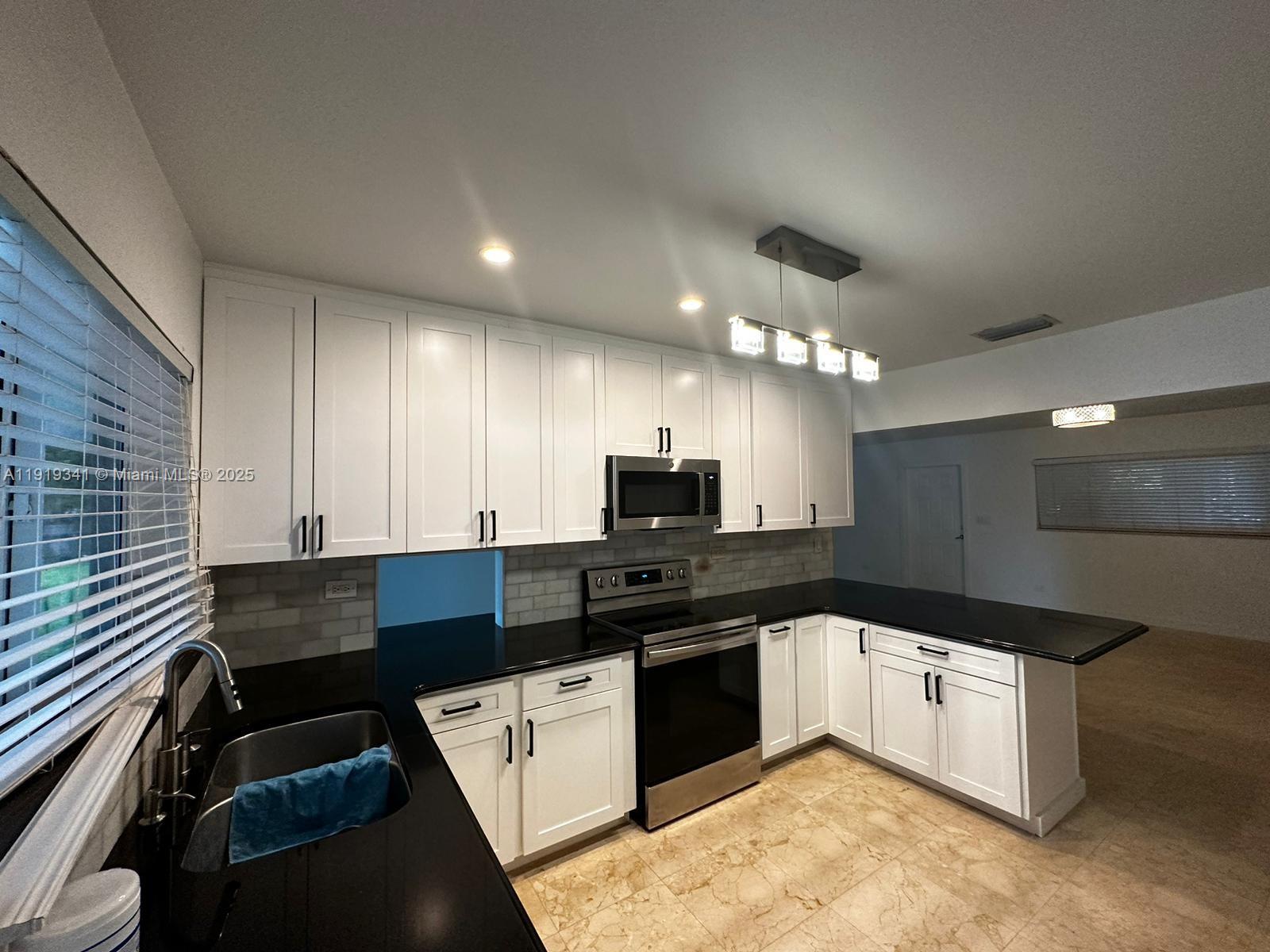 9940 Southwest 62nd Street Miami, FL 33173 - Photo 26 of 28 NEW KITCHEN