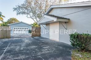 9940 Southwest 62nd Street Miami, FL 33173 - Photo 6 of 28 Separate huge garage and separate entrance for in laws