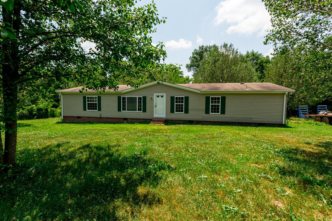 744 Tracy Road Watertown, TN 37184 - Photo 1 of 18 a view of a house with a backyard