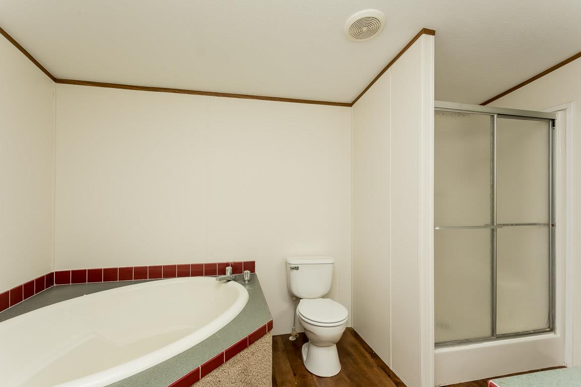 744 Tracy Road Watertown, TN 37184 - Photo 12 of 18 a bathroom with a toilet and a shower