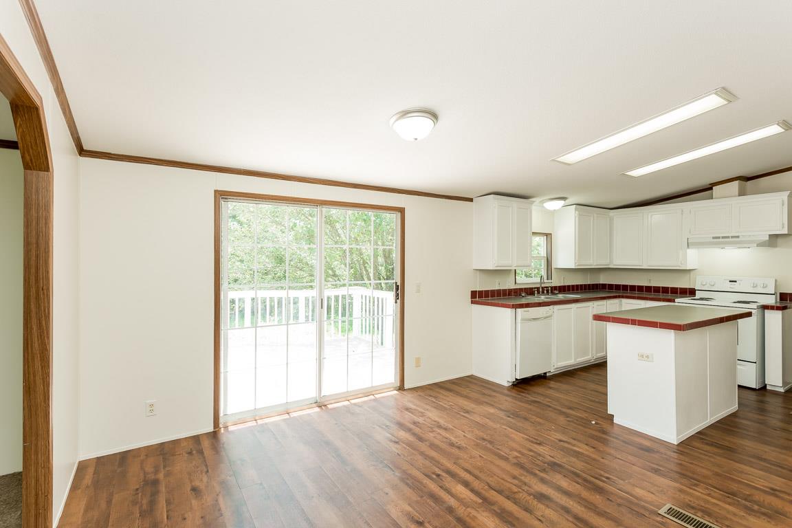 744 Tracy Road Watertown, TN 37184 - Photo 8 of 18 a kitchen with stainless steel appliances granite countertop a stove and a sink