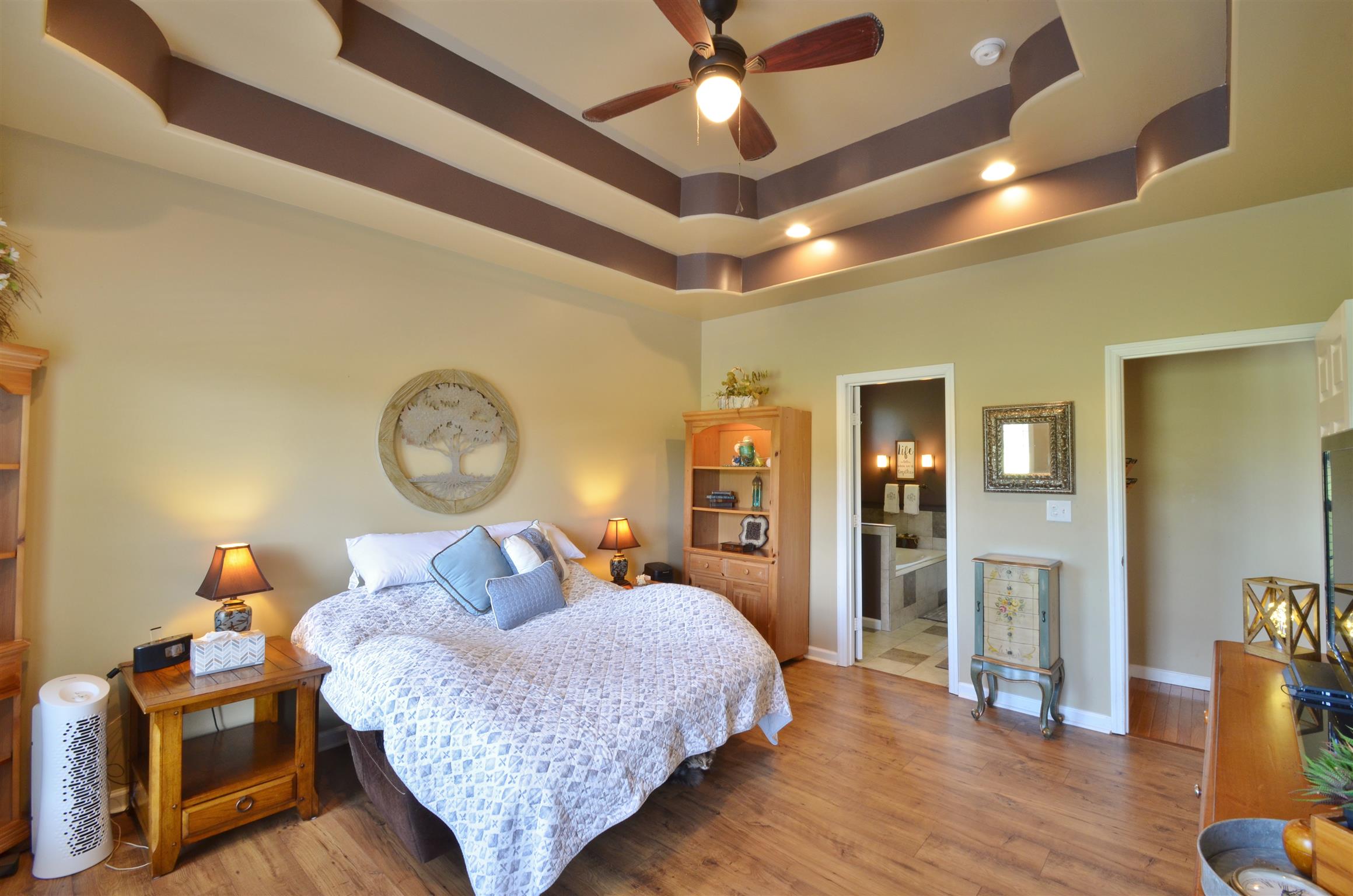 391 Vesta Road Lebanon, TN 37090 - Photo 11 of 24 a bed room with a bed and wooden floor