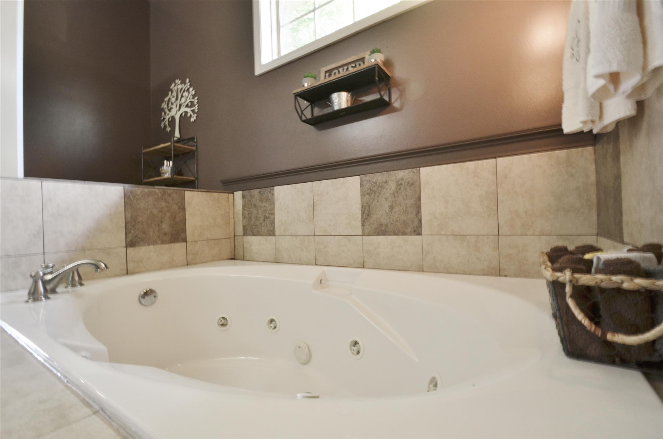 391 Vesta Road Lebanon, TN 37090 - Photo 13 of 24 a white bath tub sitting in a bathroom