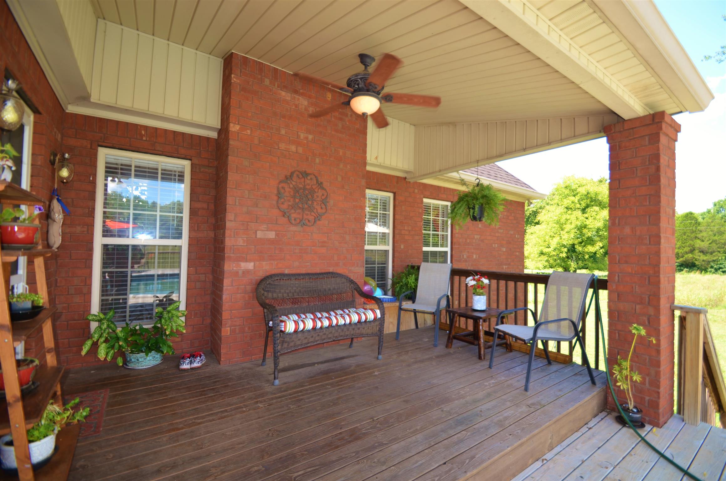 391 Vesta Road Lebanon, TN 37090 - Photo 23 of 24 a view of a porch with furniture and wooden floor
