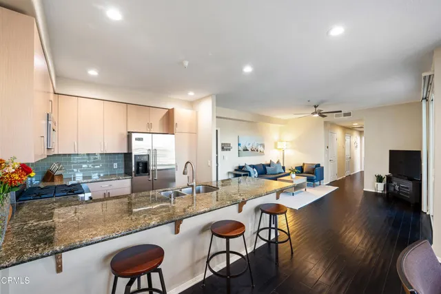 a room with dining table and chairs