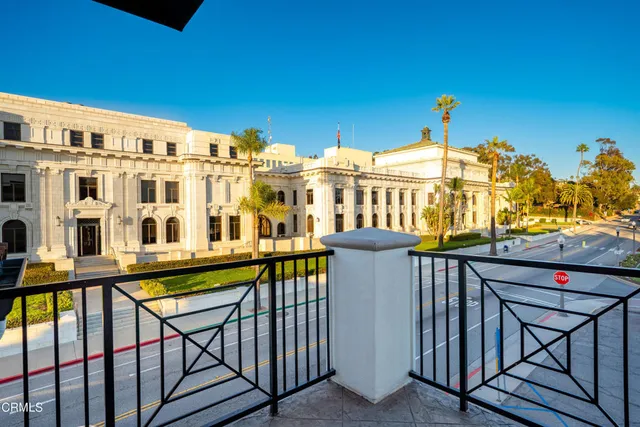 a view of a balcony with chairs
