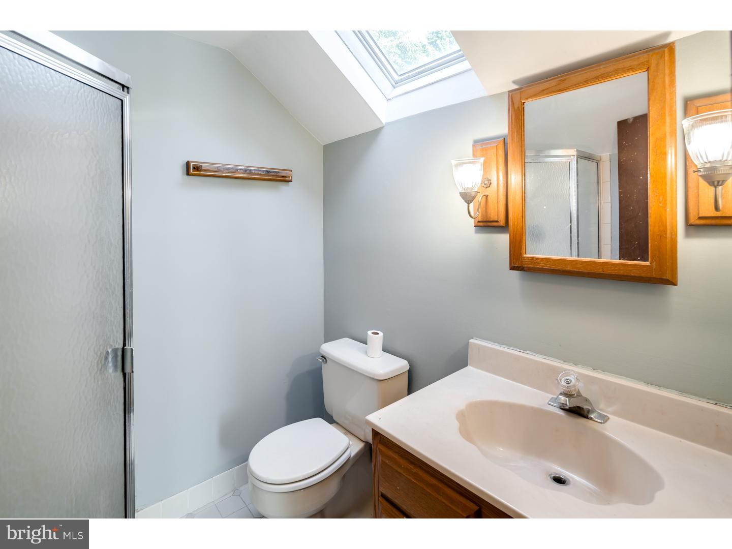 18 Princeton Road Clementon, NJ 08021 - Photo 15 of 19 a bathroom with a toilet sink and mirror