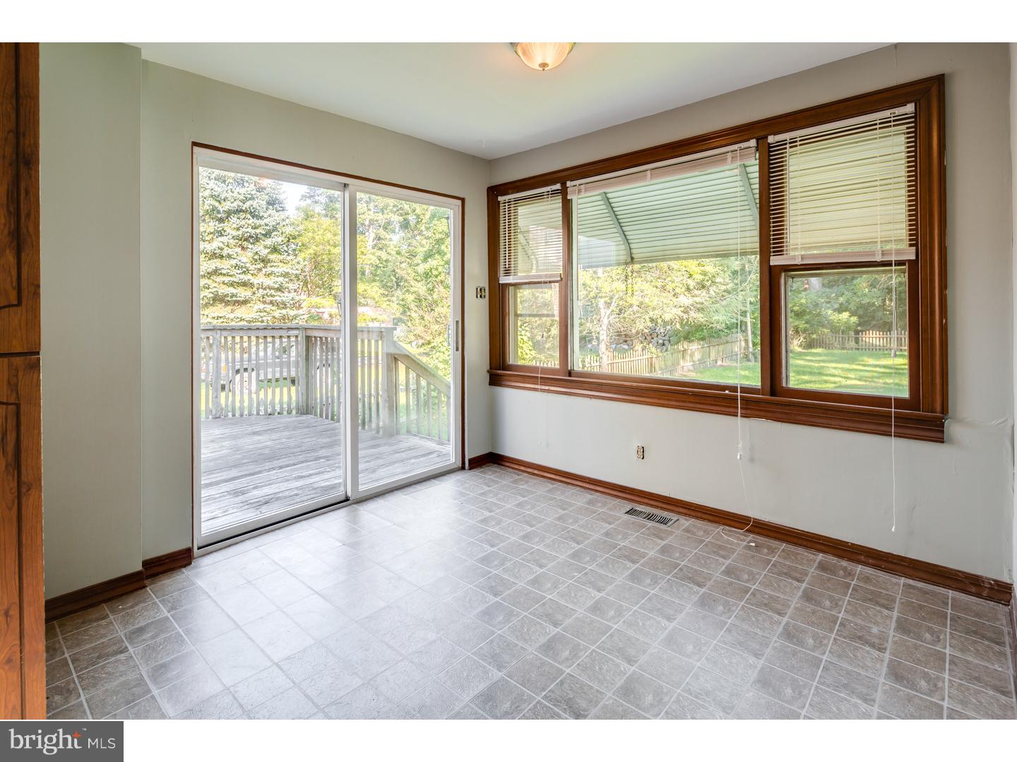 18 Princeton Road Clementon, NJ 08021 - Photo 4 of 19 a view of an empty room with wooden floor and a window