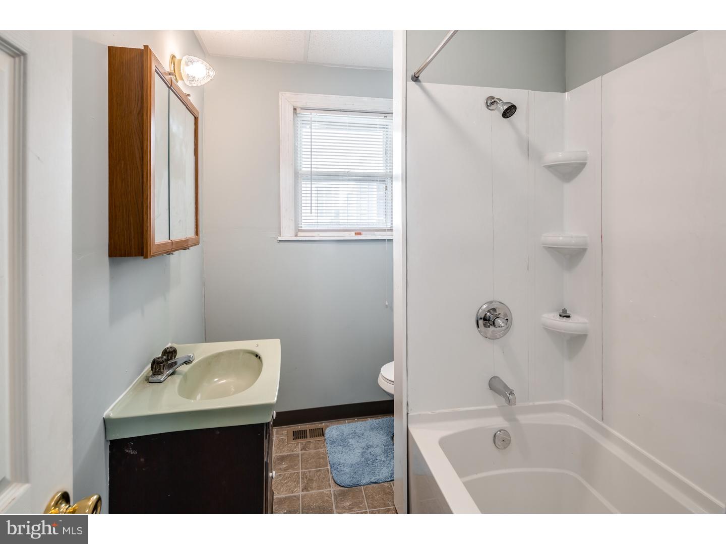18 Princeton Road Clementon, NJ 08021 - Photo 10 of 19 a bathroom with a bathtub sink vanity and mirror