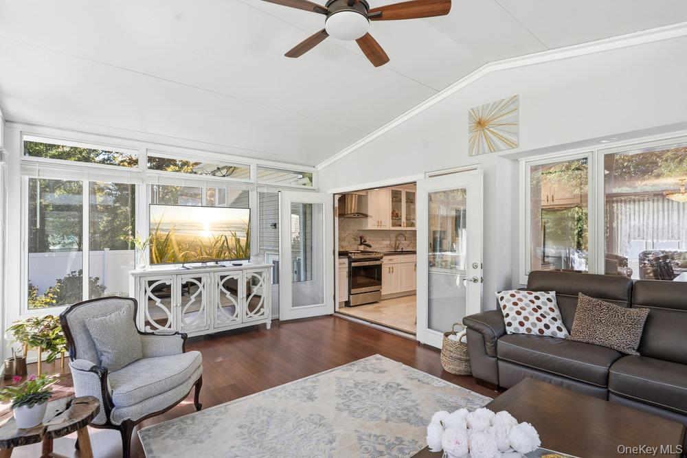 20 Vista Road Plainview, NY 11803 - Photo 18 of 37 a living room with furniture flat screen tv and a large window