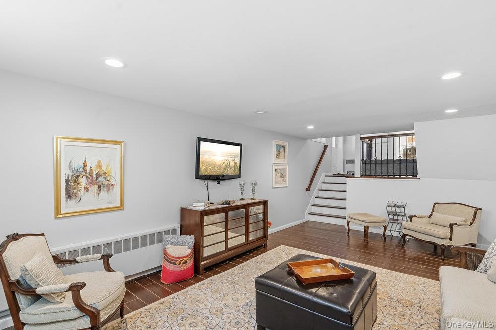 20 Vista Road Plainview, NY 11803 - Photo 24 of 37 a living room with furniture and a wooden floor