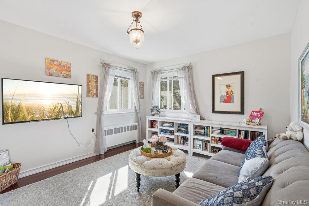 20 Vista Road Plainview, NY 11803 - Photo 28 of 37 a living room with furniture and a flat screen tv