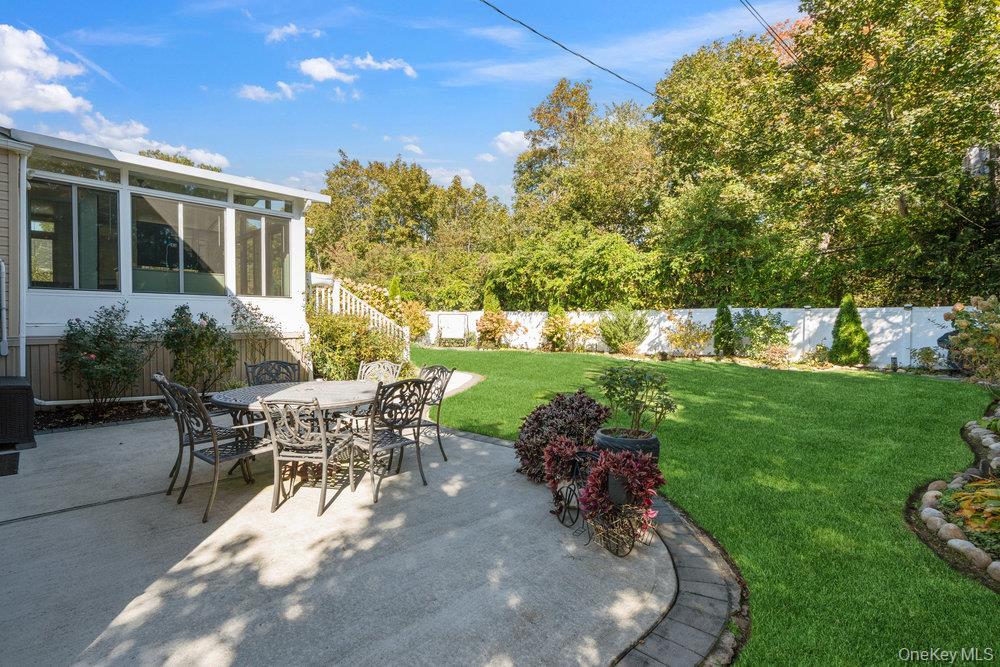 20 Vista Road Plainview, NY 11803 - Photo 32 of 37 a view of a backyard with sitting area and garden