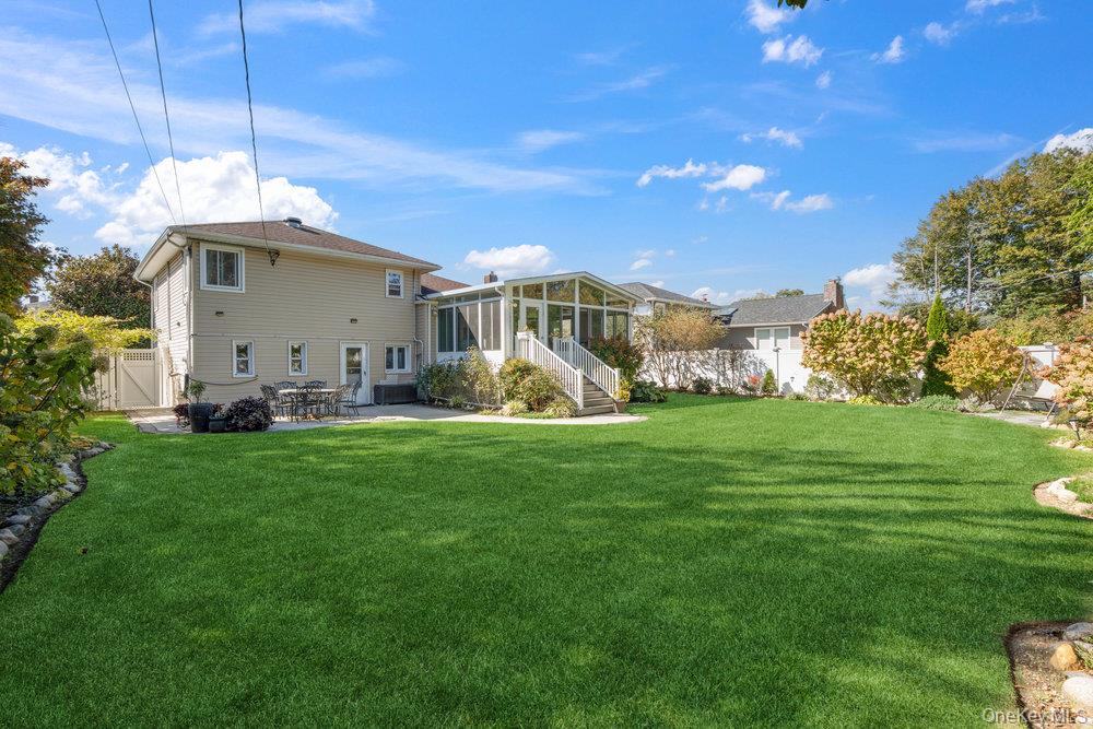20 Vista Road Plainview, NY 11803 - Photo 34 of 37 a view of a house with a yard