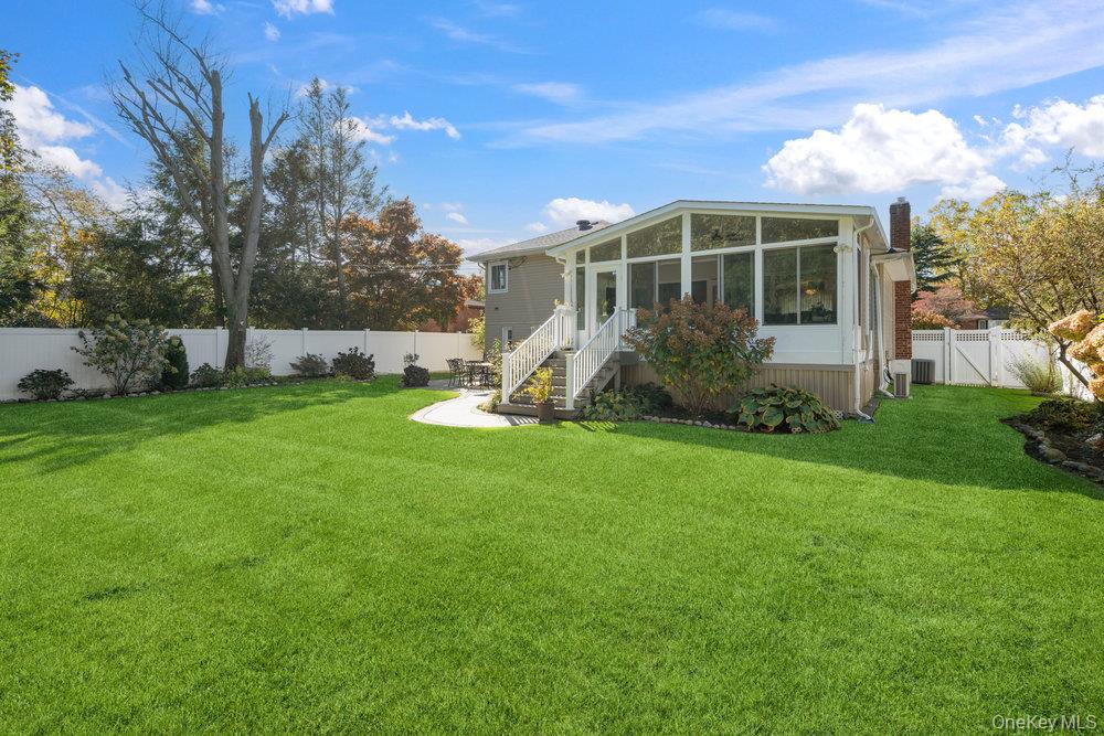 20 Vista Road Plainview, NY 11803 - Photo 36 of 37 a view of a house with a yard and sitting area