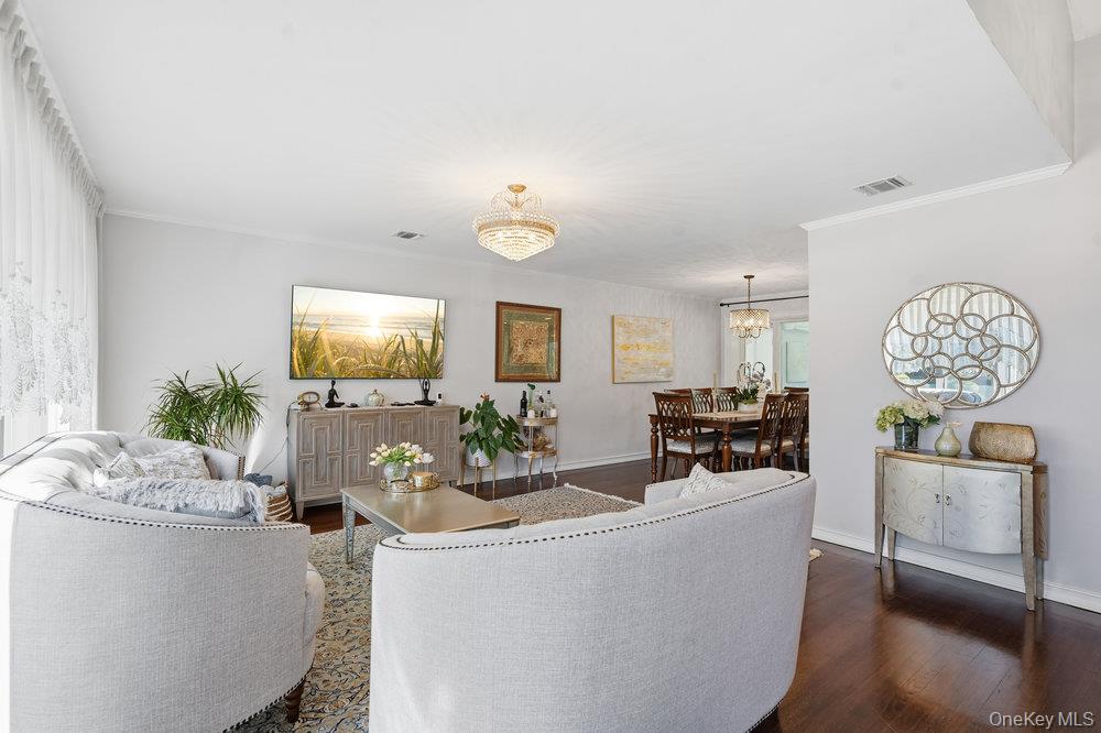 20 Vista Road Plainview, NY 11803 - Photo 4 of 37 a living room with furniture and a flat screen tv