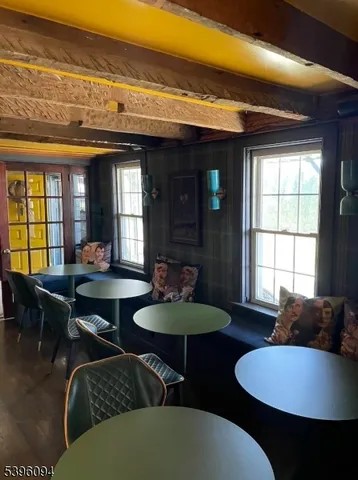 a living room with furniture a window and a dining table