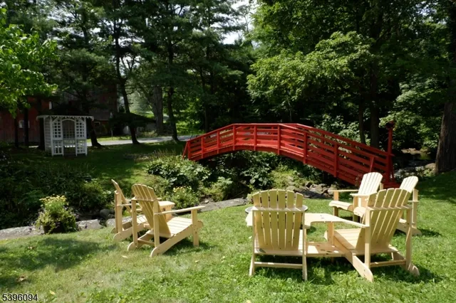a view of a chair and table under an umbrella