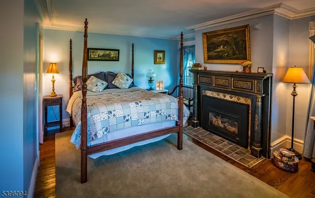 a bedroom with bed and a couch