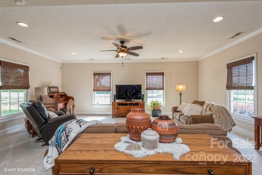 903 Jug Broome Road Monroe, NC 28112 - Photo 20 of 47 a living room with furniture and a flat screen tv