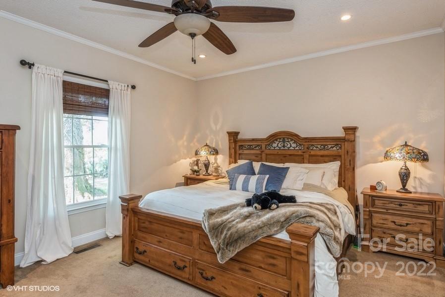 903 Jug Broome Road Monroe, NC 28112 - Photo 27 of 47 a bedroom with a bed and wooden floor