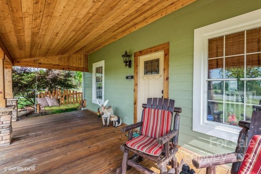 903 Jug Broome Road Monroe, NC 28112 - Photo 5 of 47 a view of a patio with table and chairs with wooden floor and fence
