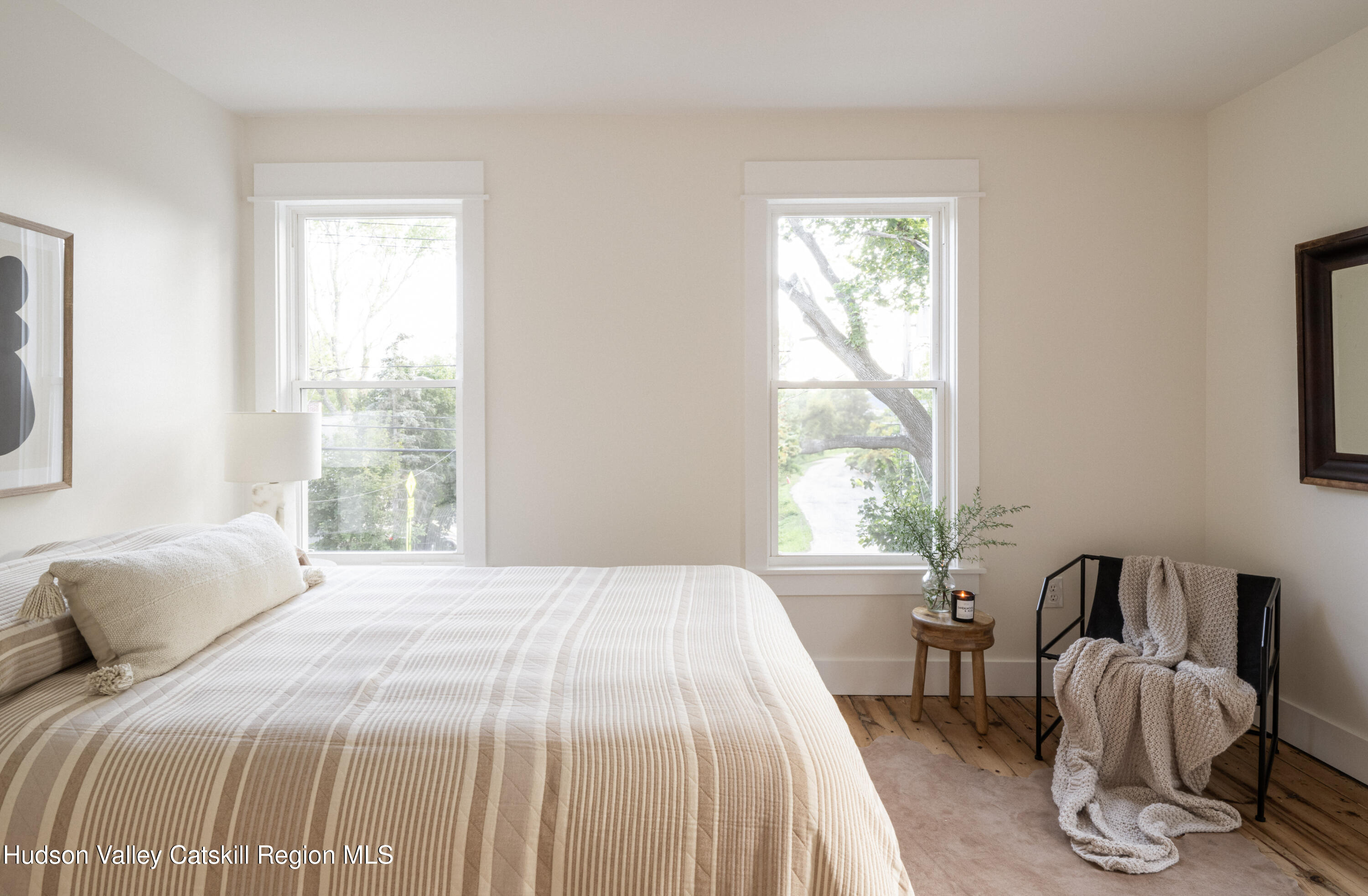 2859 Atlantic Avenue Hudson, NY 12534 - Photo 17 of 32 a bedroom with a bed and windows