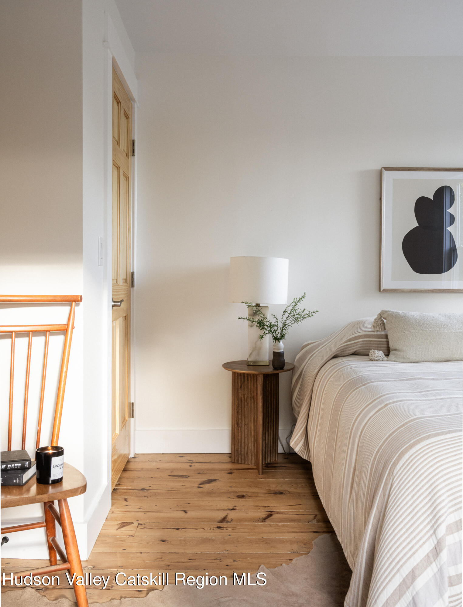 2859 Atlantic Avenue Hudson, NY 12534 - Photo 19 of 32 a bedroom with a bed and wooden floor