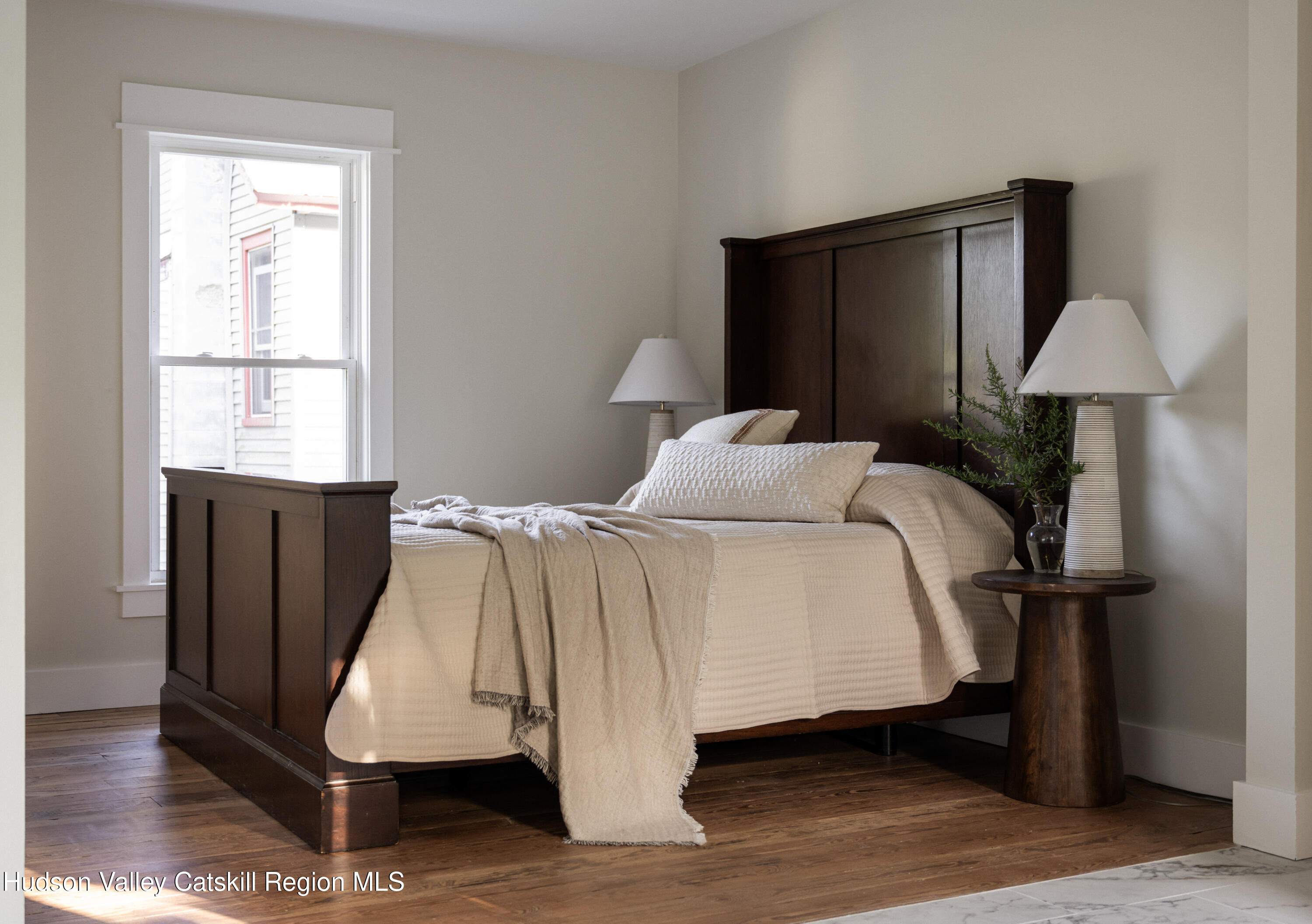 2859 Atlantic Avenue Hudson, NY 12534 - Photo 24 of 32 a bedroom with a bed and a window