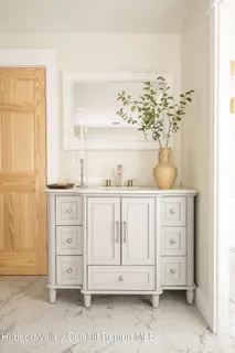 a bath tub sitting in a room next to a window