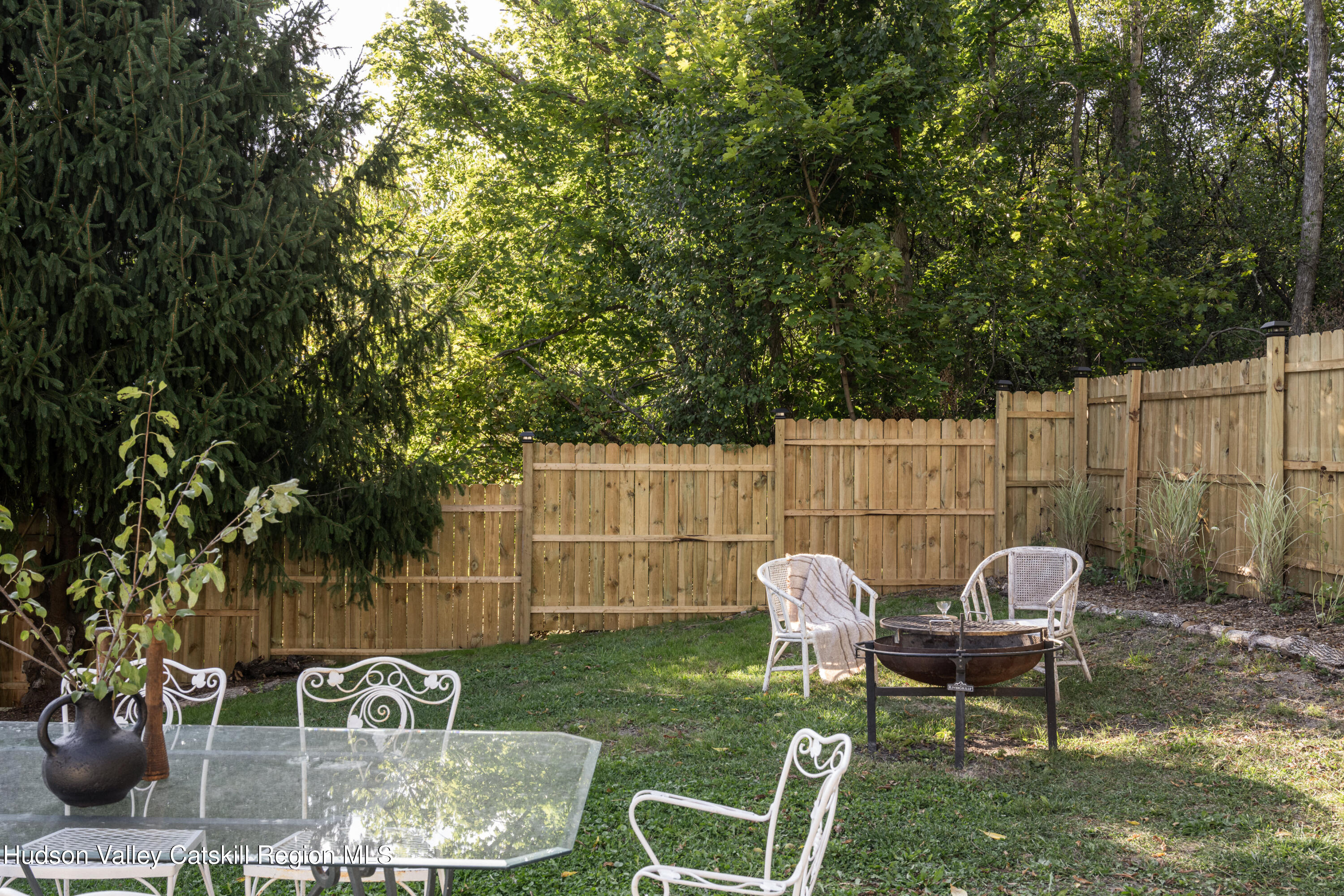 2859 Atlantic Avenue Hudson, NY 12534 - Photo 30 of 32 a view of a chairs and table in backyard