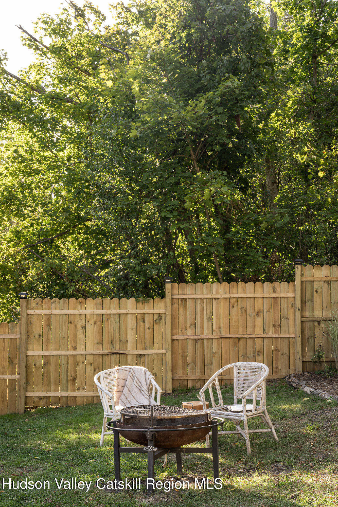 2859 Atlantic Avenue Hudson, NY 12534 - Photo 31 of 32 a view of a chairs and table in the back yard of the house