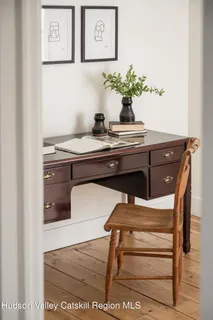 a kitchen with a sink cabinets and window