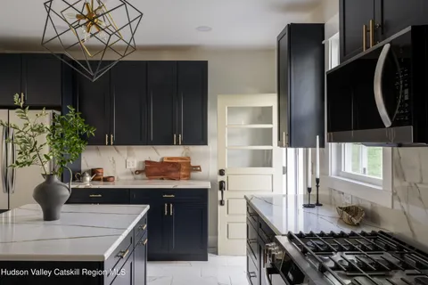 a view of table and chair with potted plant