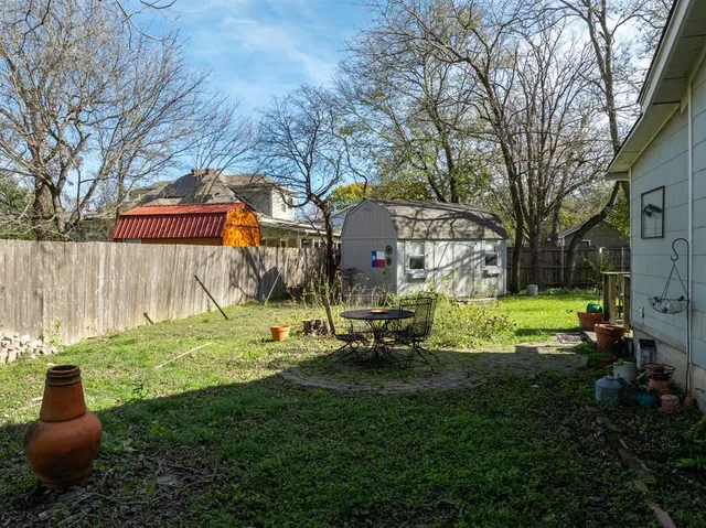 a view of a park with large trees