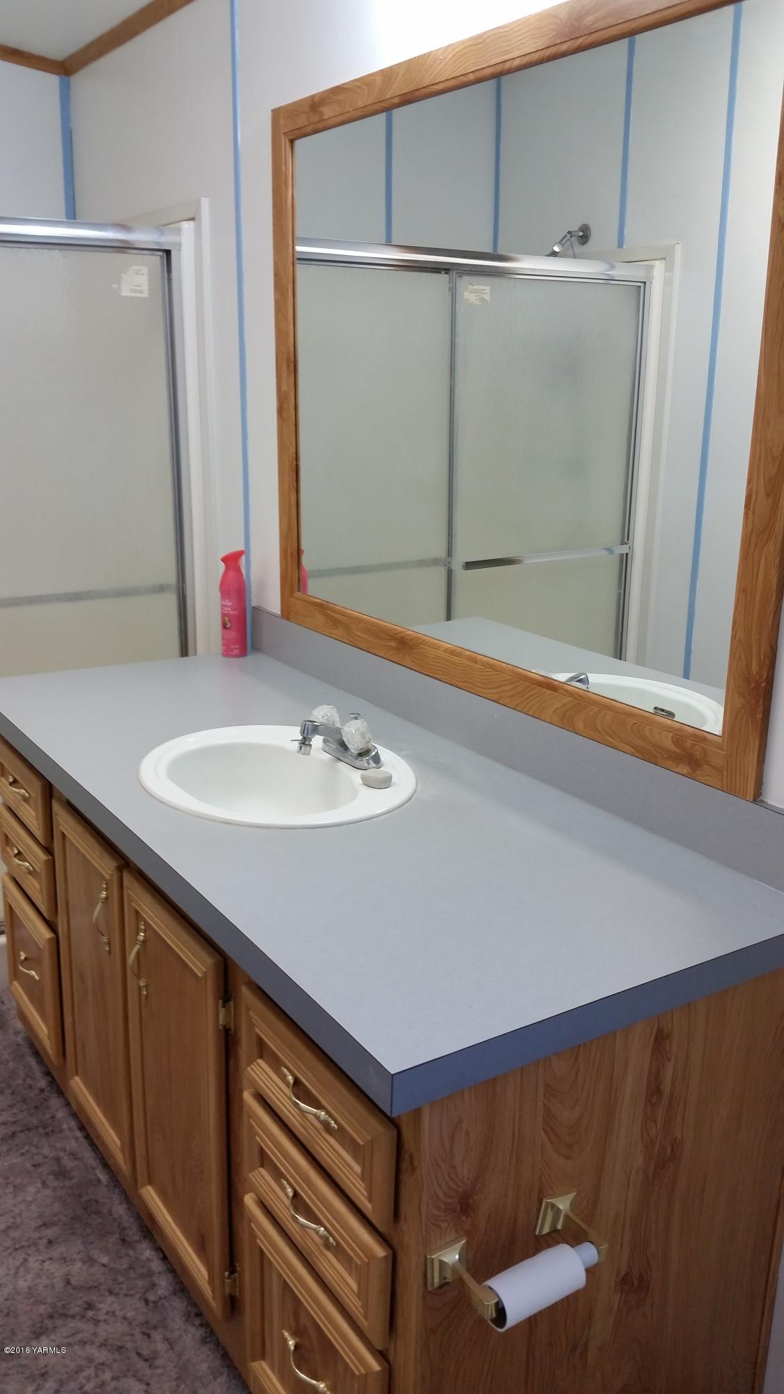 2211 Rosenkranz Road Tieton, WA 98947 - Photo 15 of 29 a bathroom with a sink and a mirror