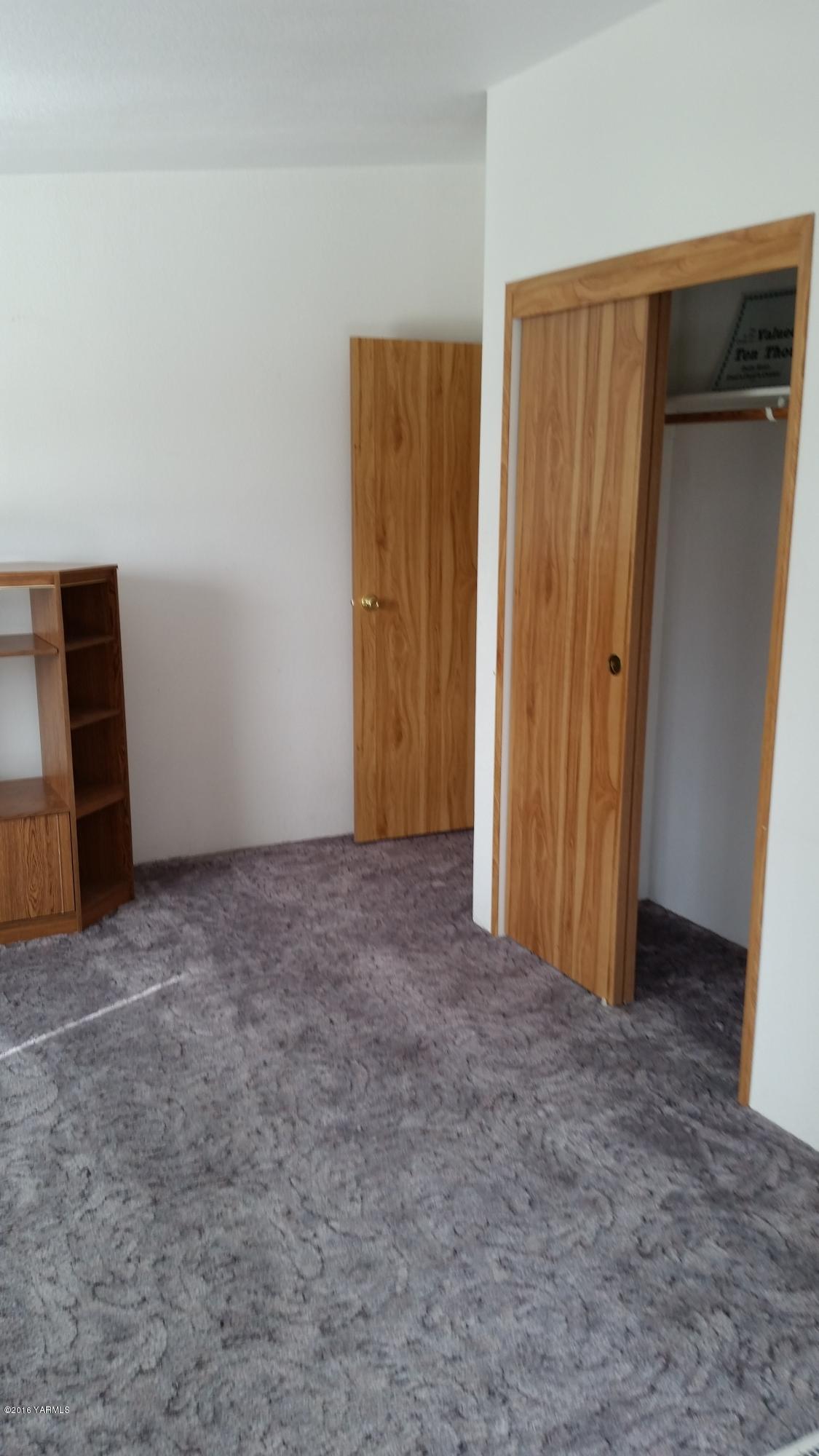 2211 Rosenkranz Road Tieton, WA 98947 - Photo 20 of 29 a view of an empty room with wooden door