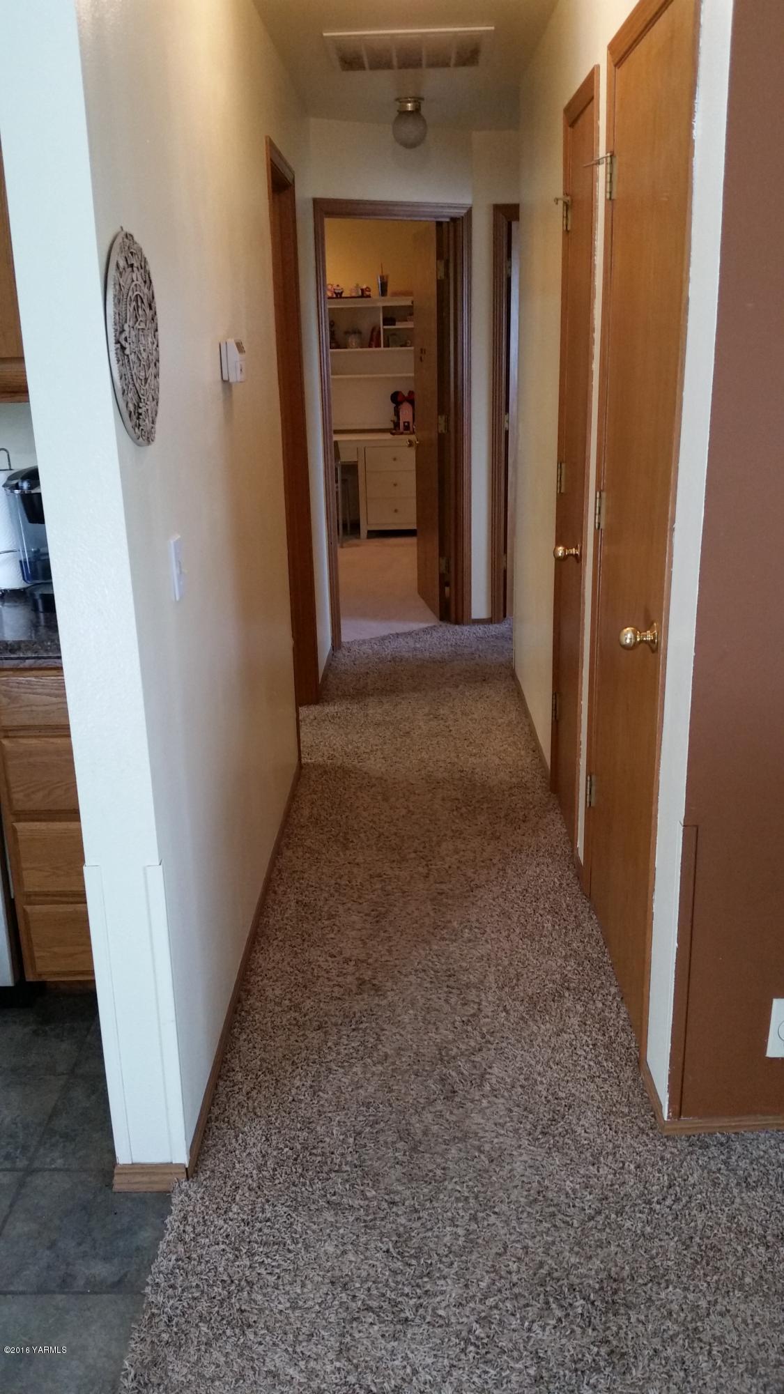2211 Rosenkranz Road Tieton, WA 98947 - Photo 29 of 29 a view of a hallway to rooms