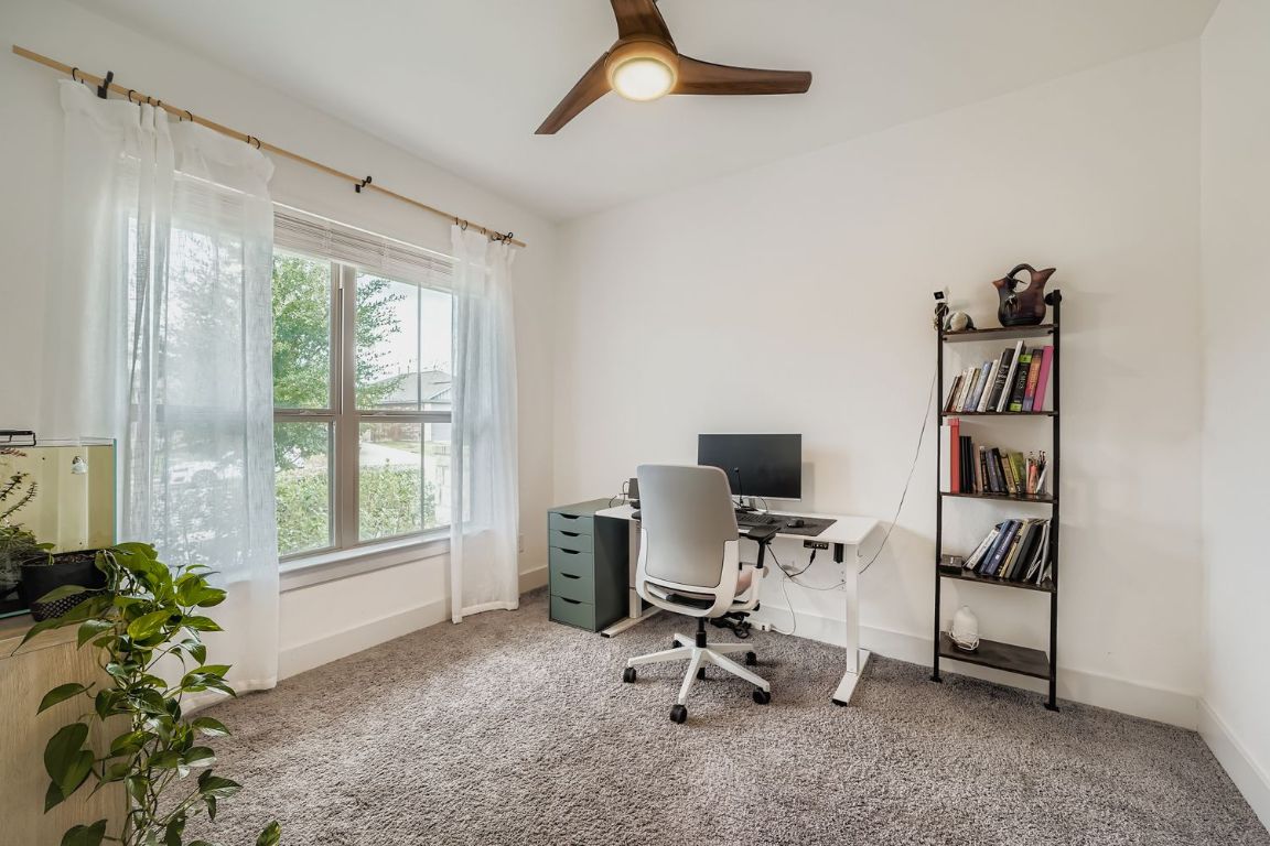 324 Clear Frk Loop Liberty Hill, TX 78642 - Photo 12 of 28 a view of a workspace with furniture and a window