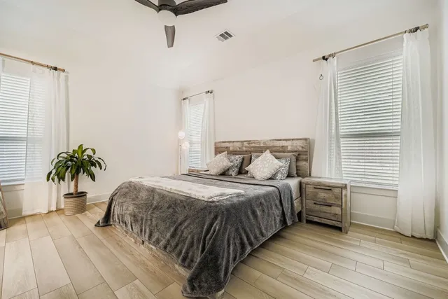 a bedroom with a bed and window