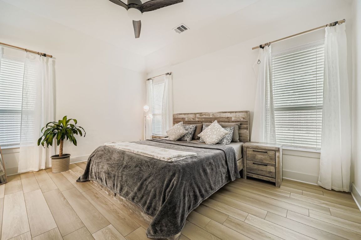 324 Clear Frk Loop Liberty Hill, TX 78642 - Photo 14 of 28 a bedroom with a bed and window