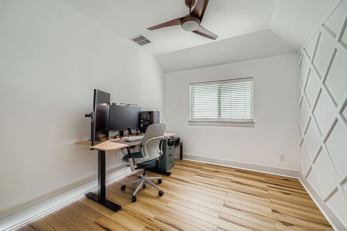 324 Clear Frk Loop Liberty Hill, TX 78642 - Photo 19 of 28 a view of workspace with wooden floor windows