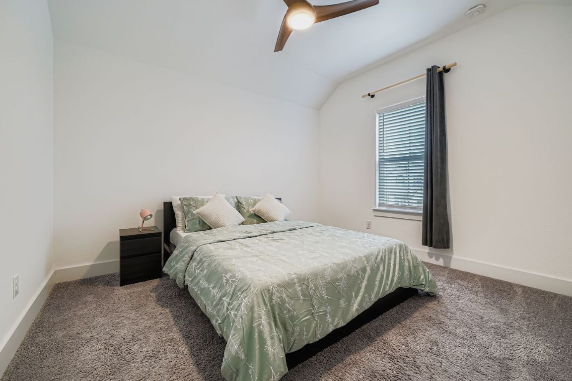 324 Clear Frk Loop Liberty Hill, TX 78642 - Photo 22 of 28 a bedroom with a bed and a window