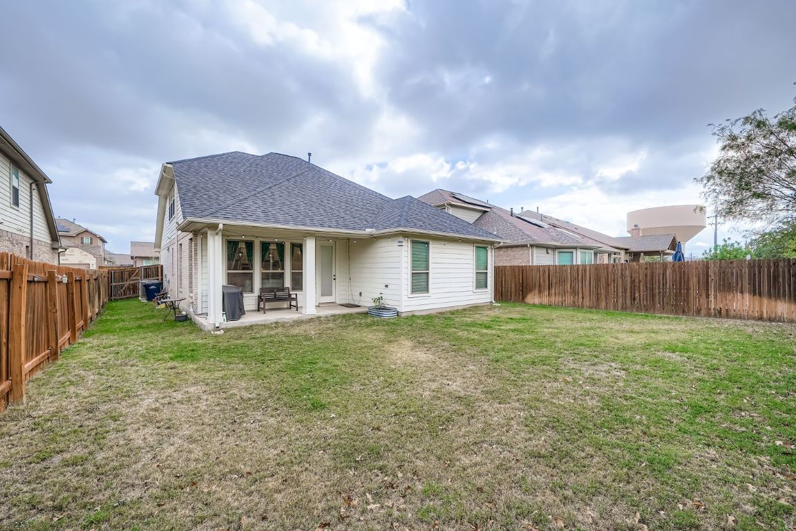 324 Clear Frk Loop Liberty Hill, TX 78642 - Photo 26 of 28 a view of a house with backyard and garden